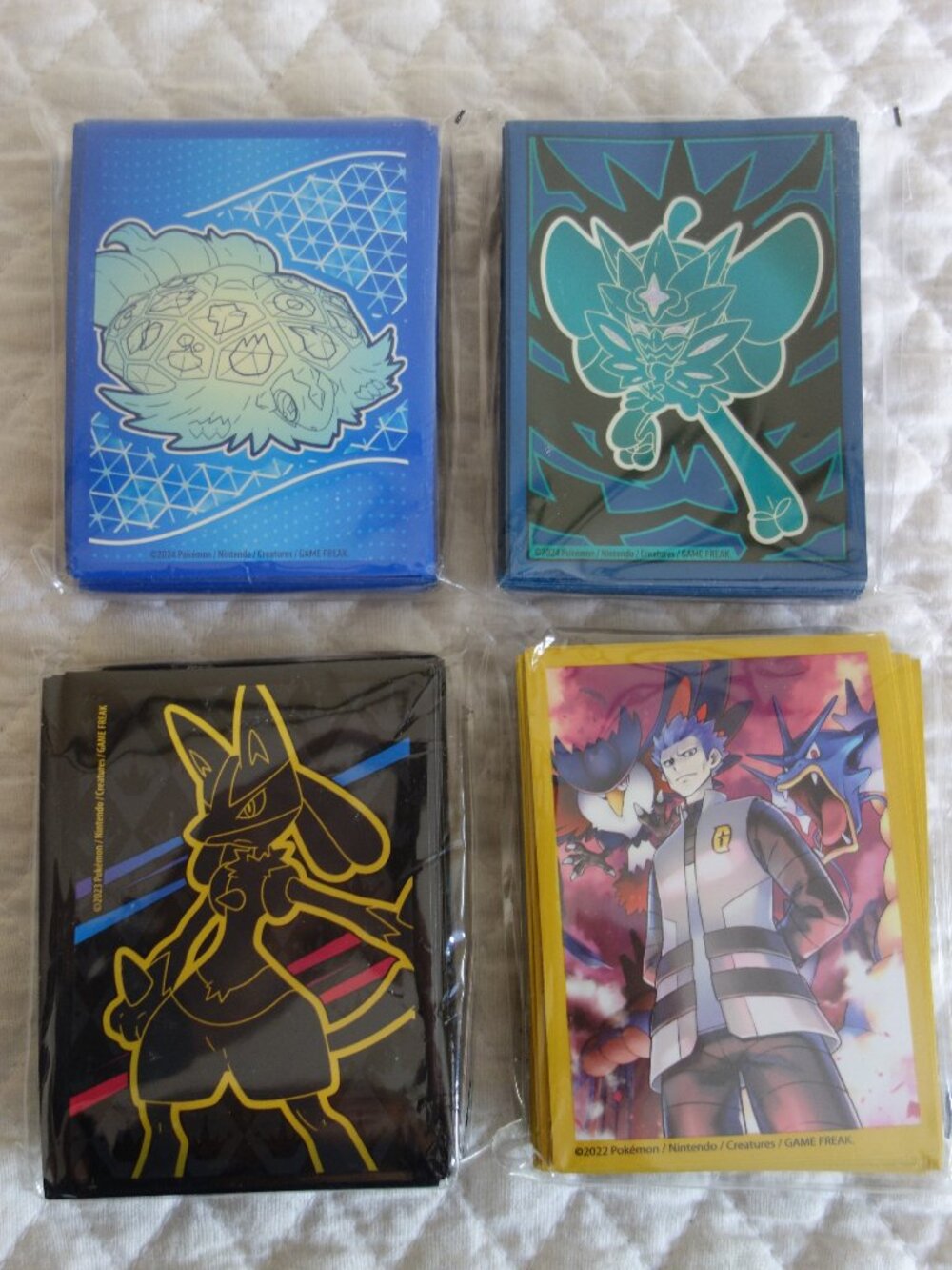 (c)	Lot of 4 NIP 65 count ea POKEMAN Trading Card Sleeves